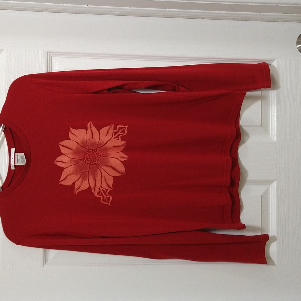 Red, stretch, long sleeve top with flower graphic.